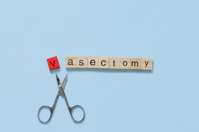 Vasectomy concept: the word vasectomy made with wooden tiles on