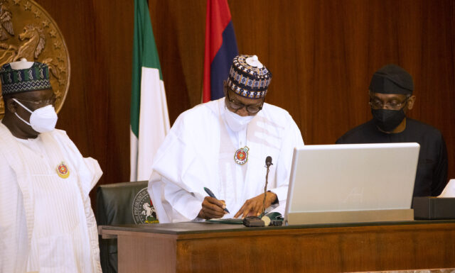 Buhari signs N17.127trn 2022 Budget into law Four bills, Buhari