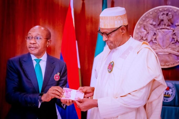 Buhari and Emefiele unveiling redesigned naira notes Redesigned naira notes
