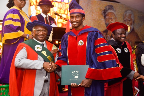 WATS Provost, Dr Tosin Awolalu presenting an award to one of the graduands Education