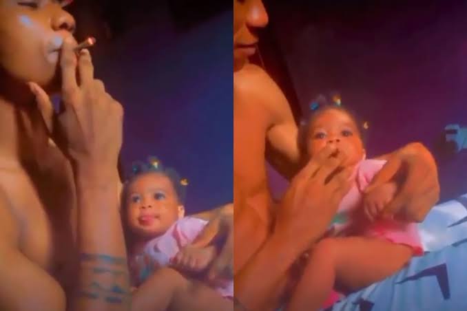 Man giving baby marijuana Marijuana