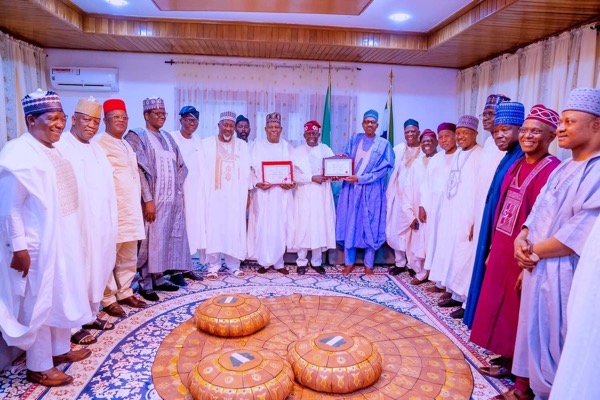 Tinubu and Shettima presenting their Certificates of Return to Buhari Tinubu