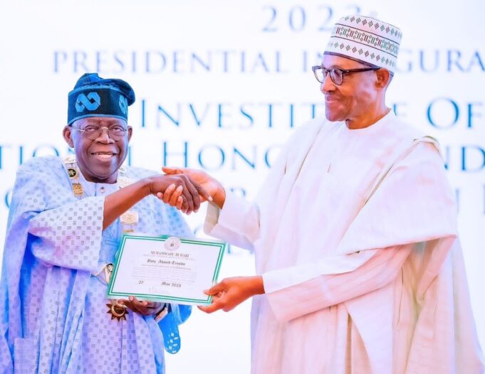 Buhari conferring national honour on Tinubu Buhari