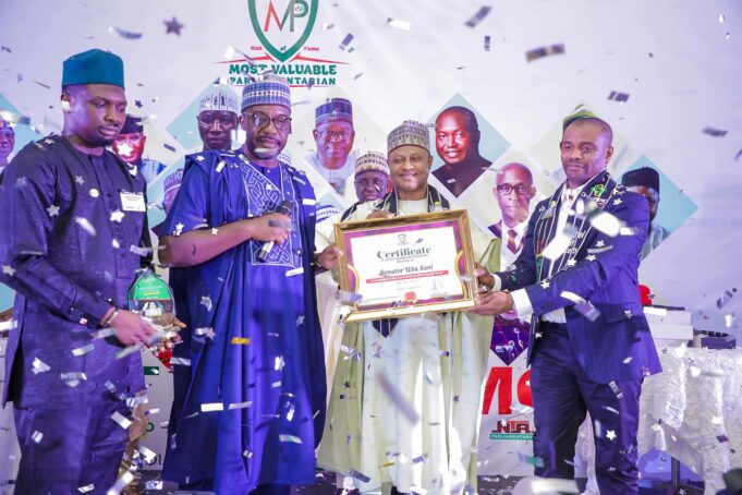 Uba Sani receiving the best lawmaker award Uba Sani