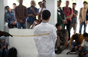 2 men flogged publicly for gay sex Men