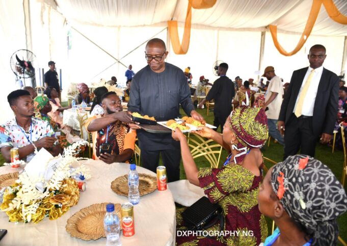 Peter Obi serving food Obi