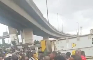 Police officer, passenger die as container falls on tricycle in Lagos