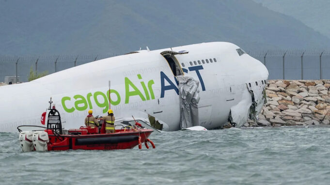 2 officials killed as cargo plane slides off runway at Hong Kong airport Hong Kong
