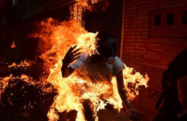 Woman sets self ablaze Woman