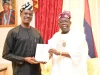 Oyedele presents Nigeria Tax Reform Acts to Tinubu in Lagos