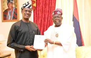 Oyedele presents Nigeria Tax Reform Acts to Tinubu in Lagos