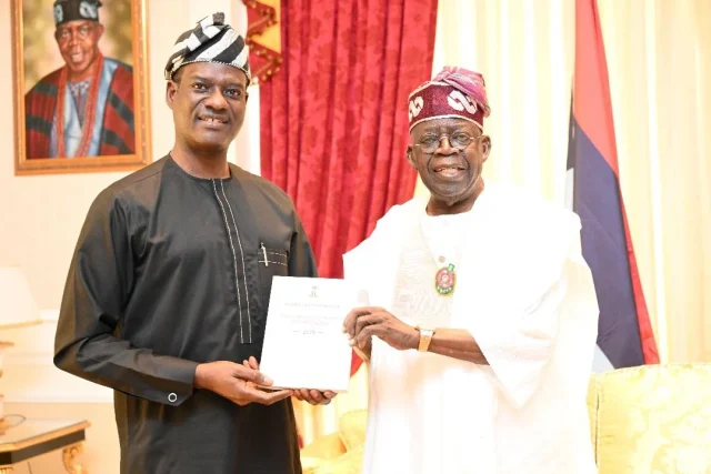 Oyedele presents Nigeria Tax Reform Acts to Tinubu in Lagos