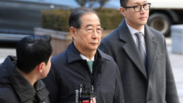 Ex-South Korean PM Han jailed for 23 years Han