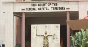 Justice Crack remains in custody as lawyers disagree over defence leadership