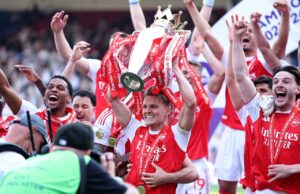 Arsenal lift Premier League trophy as Tottenham survive relegation Arsenal