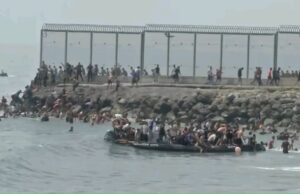 PHOTOS: Thousands of migrants cross into Spain’s Ceuta in mass border breach
